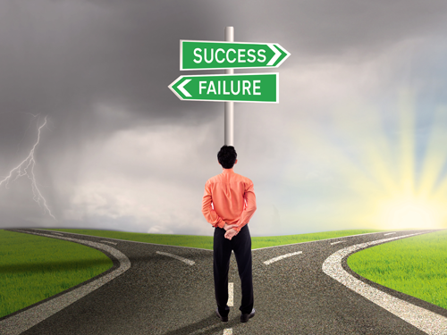 Businessman at Success or Failure crossroads
